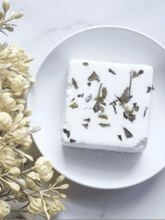 Load image into Gallery viewer, Lavender and rose shower fizzies by Natural Soy Creations with pink petals on white dish.