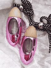 Load image into Gallery viewer, Pink bullet car diffuser with wood top on silk material, releasing fragrance for cars and small spaces.