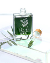 Load image into Gallery viewer, Aurora Organic Night Oil bottle with dropper and green plant, natural blue tansy facial elixir for hydration and repair.