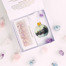 Load image into Gallery viewer, Opened Bopo Women Halo Hair Drops gift box showing the hair oil bottle and lilac acetate comb presented with soft pink accents.