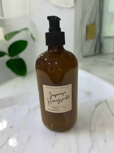 500ml goats milk hand soap in an amber pump bottle, labelled Japanese Honeysuckle by Natural Soy Creations