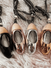 Load image into Gallery viewer, Set of four bullet car diffusers with wood tops and cords, including the black diffuser option.

