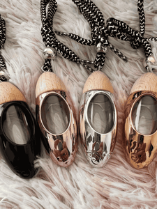 Set of four bullet car diffusers with wood tops and cords, including the black diffuser option.