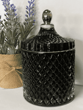 Load image into Gallery viewer, Deluxe royal black geometric candle with silver trim and lid, styled beside plants on a neutral background, 500ml soy wax candle.
