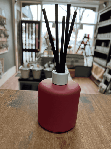 Grape matte reed diffuser with black reeds for home fragrance.