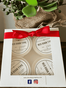 Gift box of soy melt shot pots in Red Door Type fragrance, packaged with a red ribbon and window display.