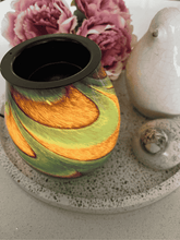 Load image into Gallery viewer, Giselle Glass Electric Heat Plate Wax Warmer glowing in amber and green hues beside pink flowers – Natural Soy Creations
