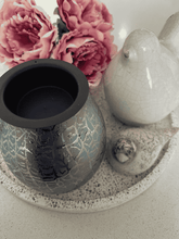 Load image into Gallery viewer, Close-up of Indigo Alaska glass electric wax melt warmer with gentle light – Natural Soy Creations
