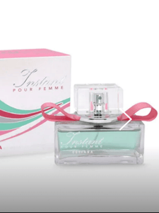 Instant Pour Femme Eau de Parfum by Estiara, light green fragrance in a clear glass bottle with pink ribbon detail, displayed with matching pink and green box.