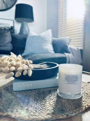 Large white Monaco soy candle in gift box, styled on table for elegant home décor and relaxation.