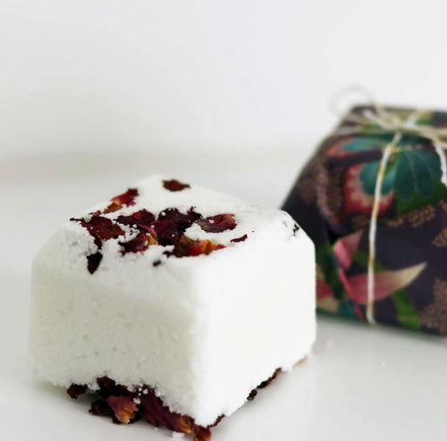 Natural Soy Creations Magnolia and Rose bath bomb with organic rose petals, displayed with floral wrapping.