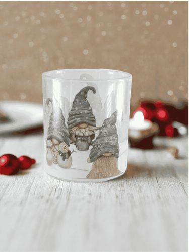 Santa’s Helpers Soy Candle in frosted glass jar with gnome design and festive Christmas décor.