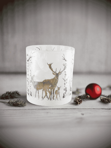 Scandi Snow Deer Soy Candle in frosted glass jar with gold deer design and festive décor.