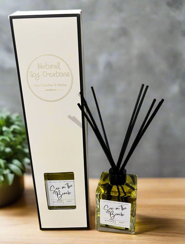 Sex on the Beach reed diffuser by Natural Soy Creations, square glass bottle with black reeds and matching gift box