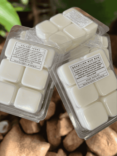 Soy wax melts in clam shell packaging, labelled with fragrances including Velvet Peony and Brazilian Bum Bum.