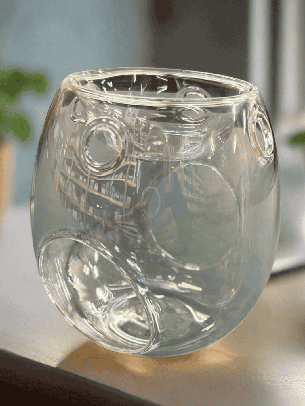 Clear glass tea light melt warmer with circular patterns, designed for melting wax melts with a candle underneath.