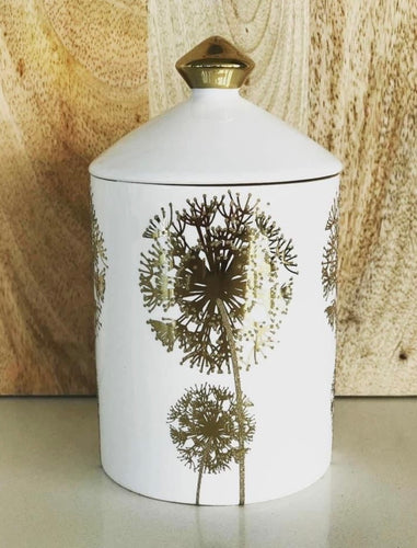 White ceramic soy candle jar with gold dandelion design and gold-tipped lid
