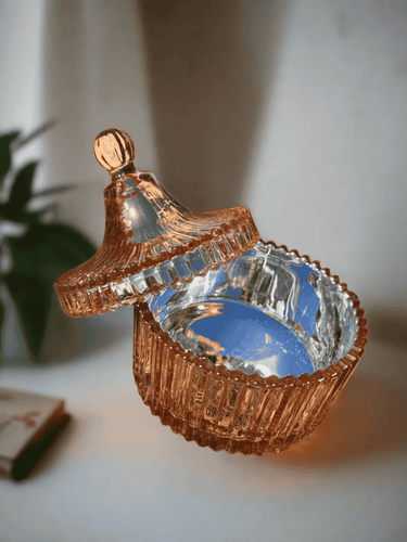 White ceramic soy candle jar with gold dandelion design and gold-tipped lid.