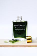 Load image into Gallery viewer, Aurora Night Oil by Bopo Women displayed on marble surface with greenery, organic skincare blend for evening routine.
