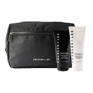 A facial cleansing kit containing a black face scrub and a white moisturizer bottle, both with the brand name 'charles & lee'.