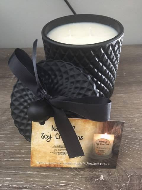 Deluxe matte black geo soy candle with gift box and ribbon, luxury double-wick design for elegant home décor.