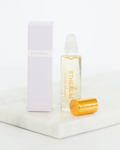 Ethereal crystal perfume roller by Bopo Women with box and gold lid, jasmine and neroli essential oil blend for natural fragrance.