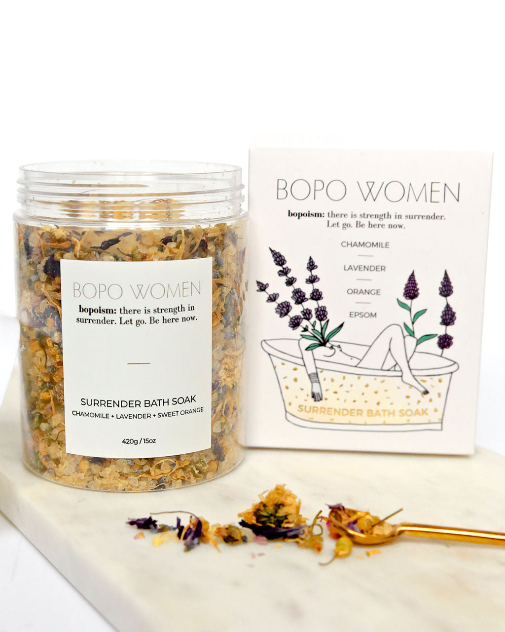 Sacred Surrender bath soak jar and box displayed with dried lavender and flowers, calming blend for relaxation and self-care.